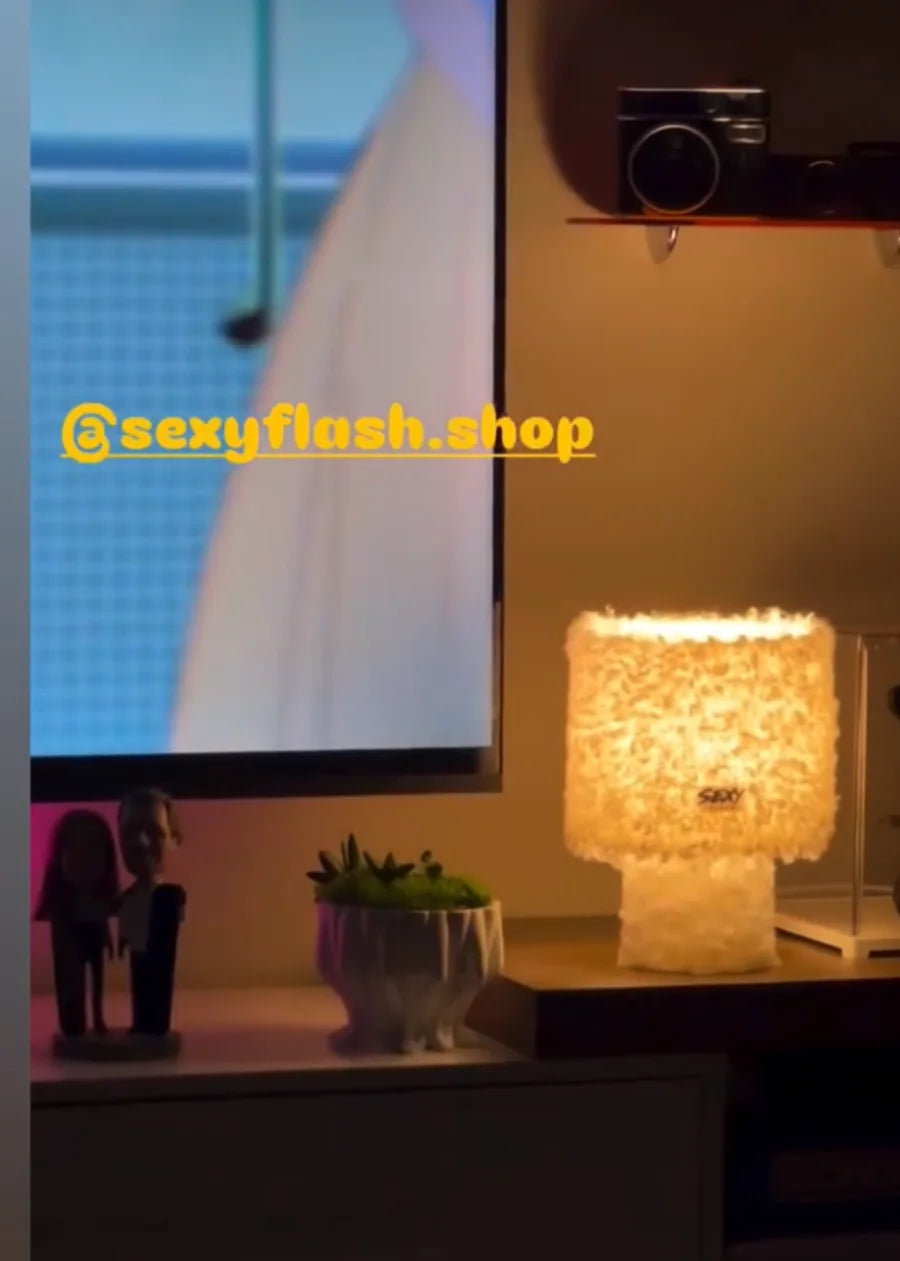 White SEXY FLASH lamp glowing in a customer's Los Angeles home